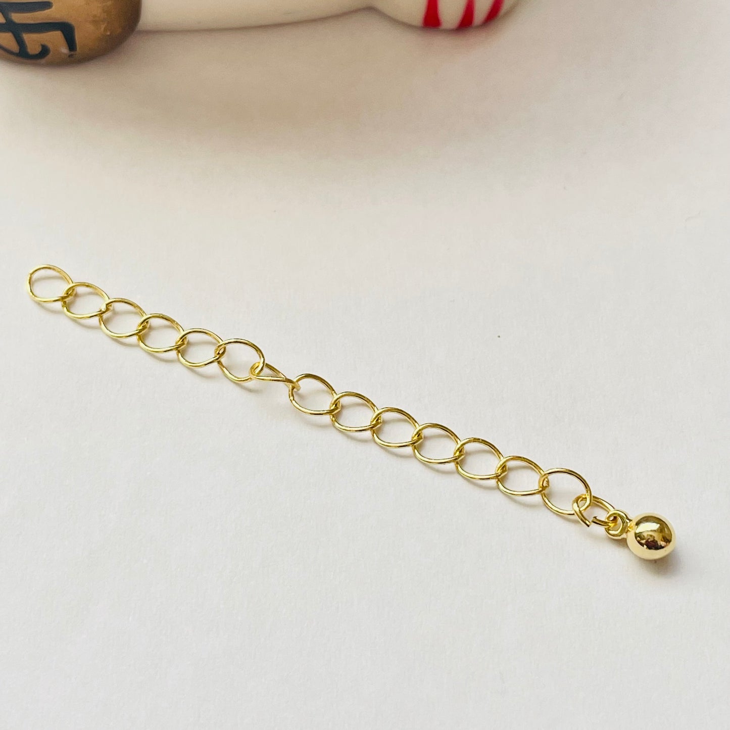 AO146 Extensor o Alargue para collar o pulsera con terminal de bolita diá. 4 mm Largo 5.5 cm Accesorio Baño Oro Accesorios Bañados hecho de Bronce Bañado en Oro 18K Joyas Bañadas en Oro