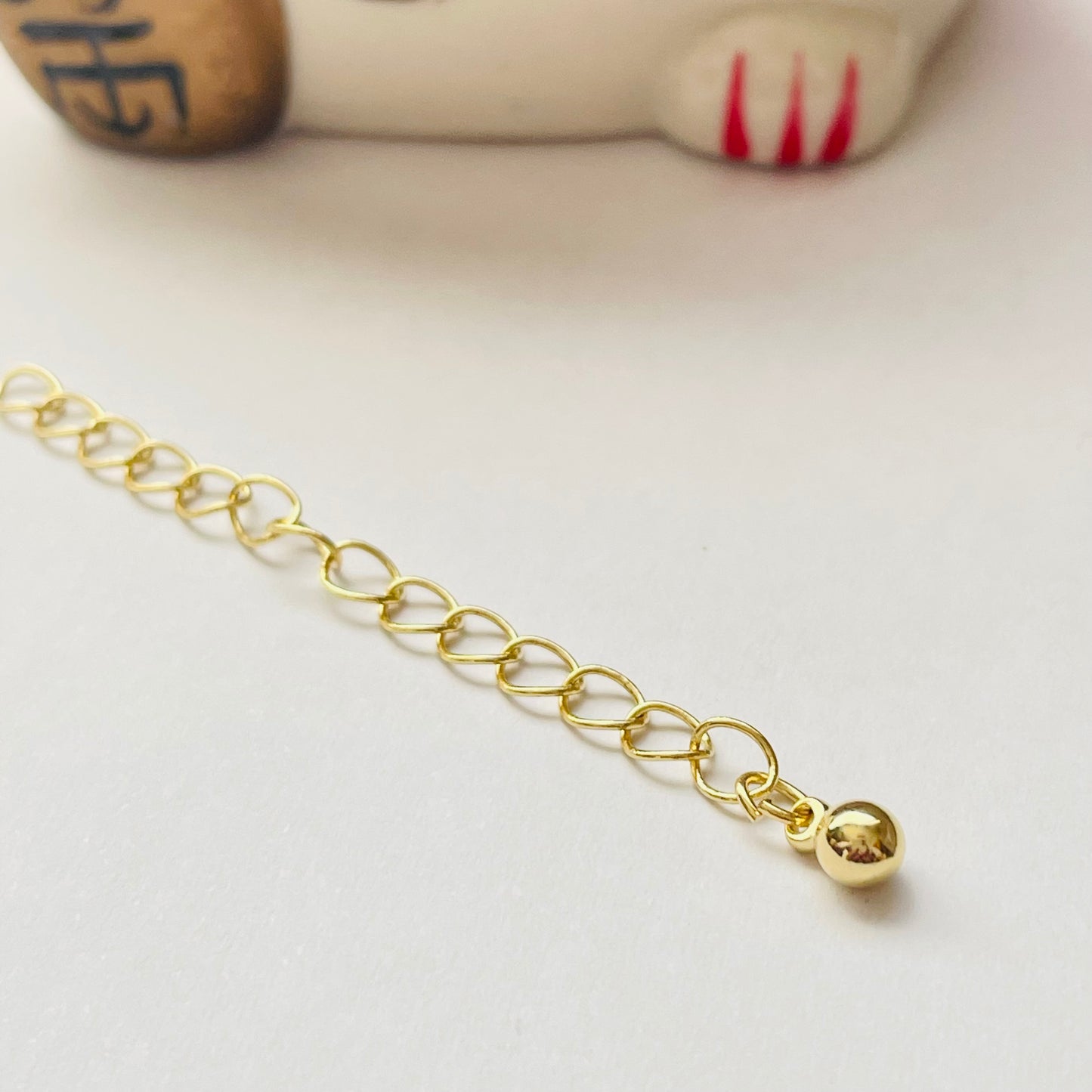 AO146 Extensor o Alargue para collar o pulsera con terminal de bolita diá. 4 mm Largo 5.5 cm Accesorio Baño Oro Accesorios Bañados hecho de Bronce Bañado en Oro 18K Joyas Bañadas en Oro